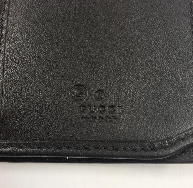 Gucci cartera logo piel negra/café  - boutique